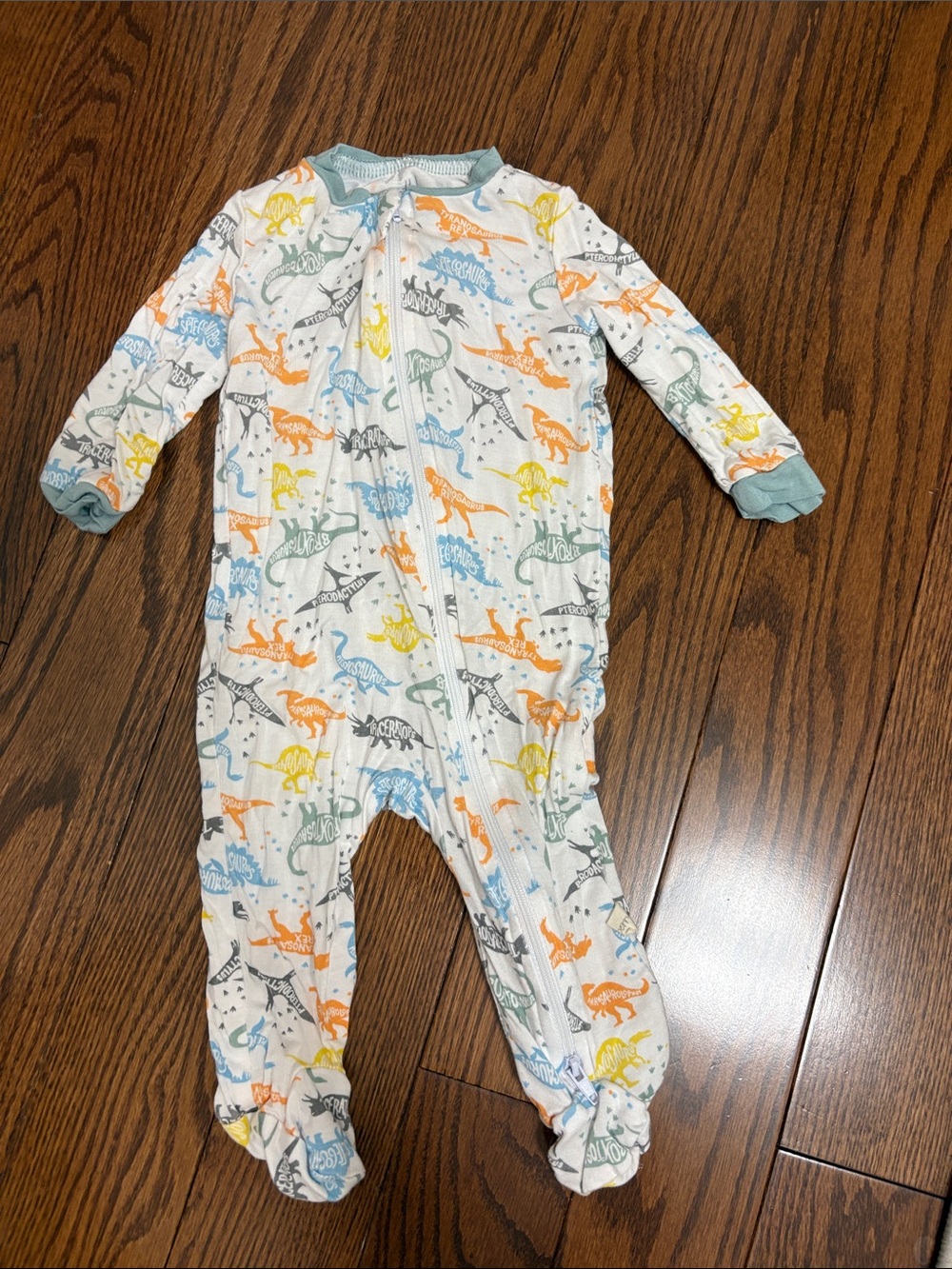 Infant Footed One-Piece in White with Multicolor Dinosaur Print